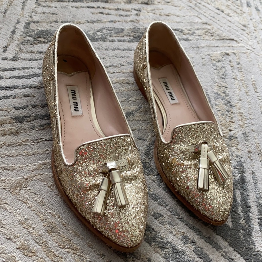 Miu Miu gold glitter flats.